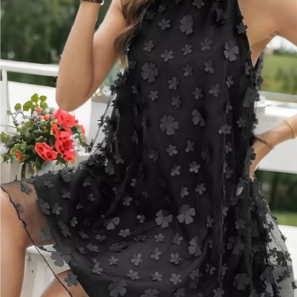Mi Ami black halter A line dress with detailed floral design.